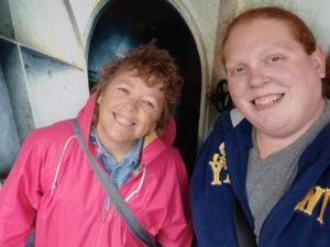 Two women smiling at camera.