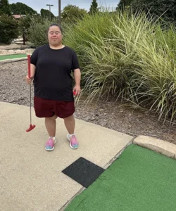 Woman at putt putt golf.